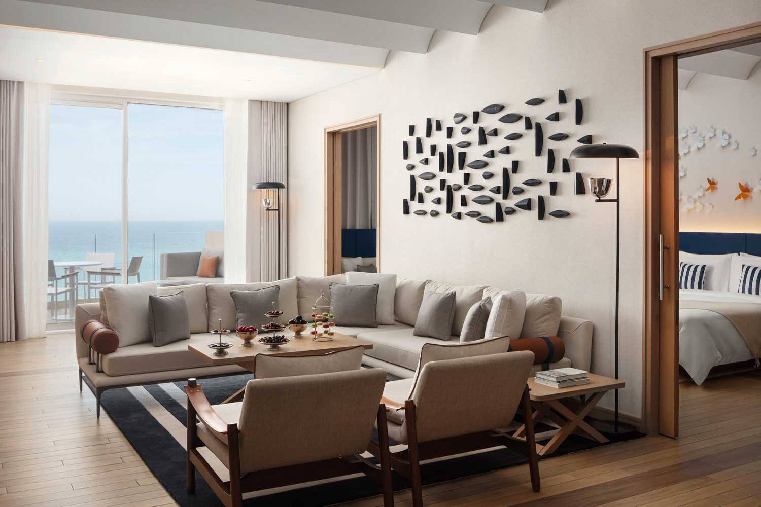 Ocean view suite with modern seating and decor