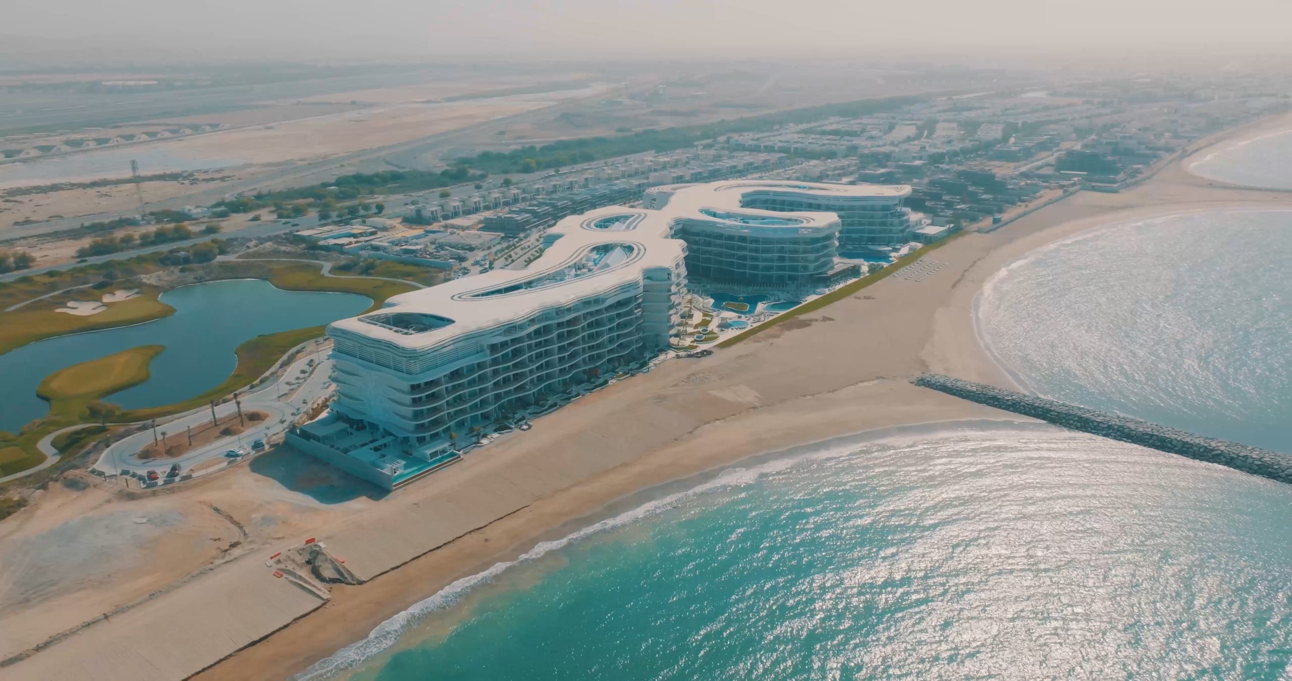 Aerial view of beachside modern resort complex