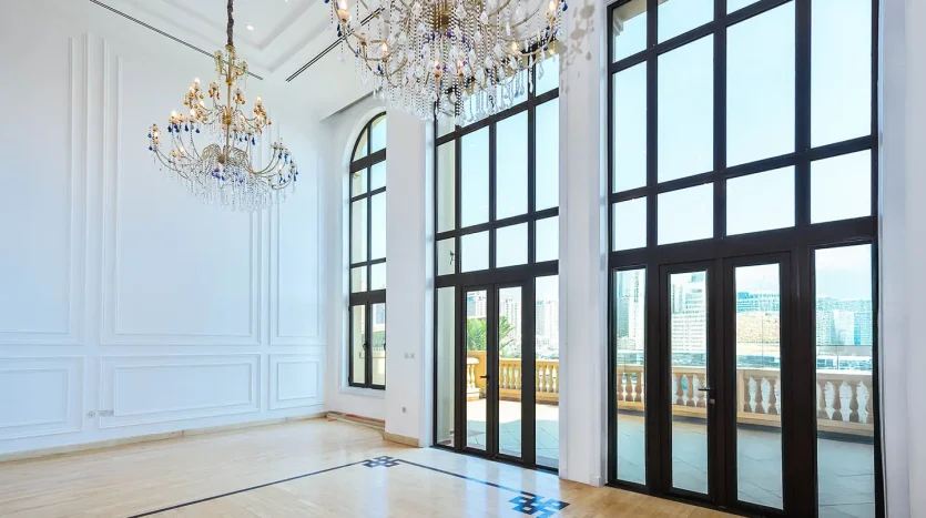 Bright room with chandeliers and large windows