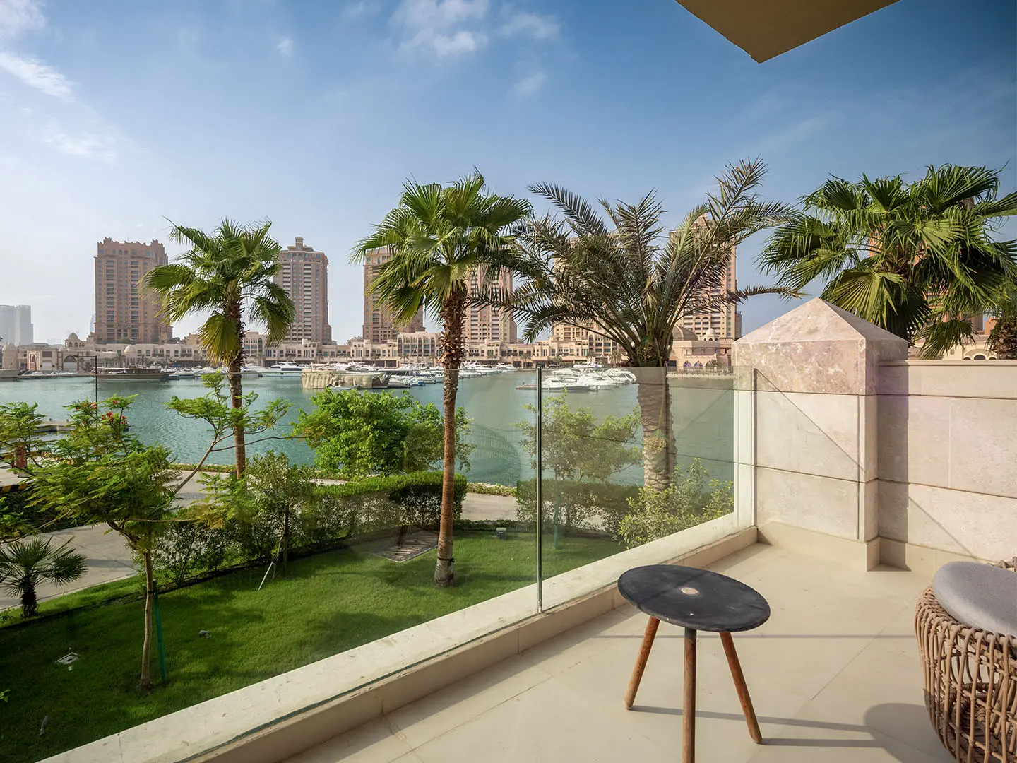 Green palms guard tranquil marina view