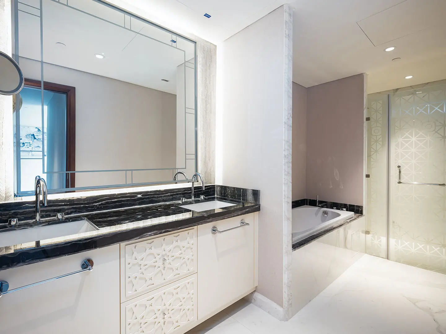 Sleek marble sink with twin faucets shines