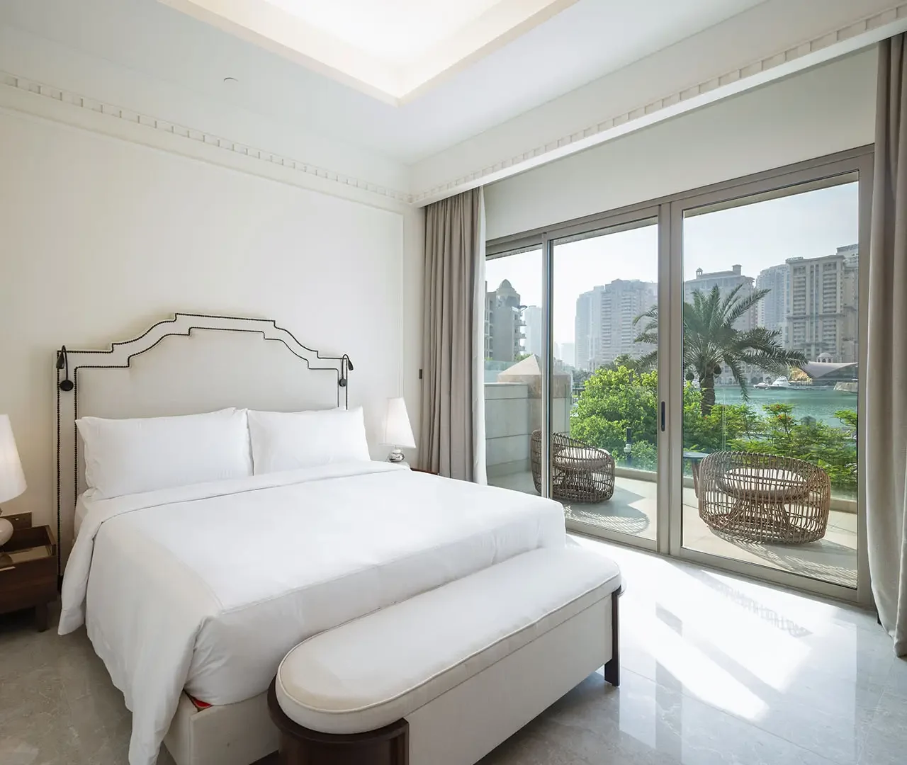 Elegant room overlooking yachts and skyline