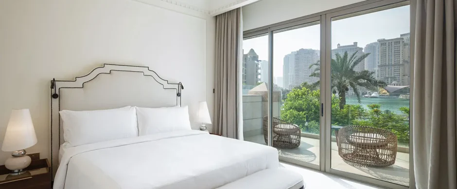 Elegant room overlooking yachts and skyline