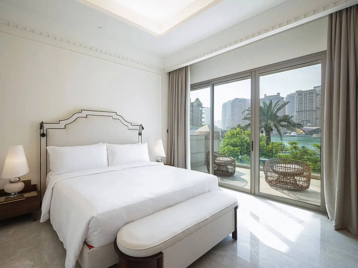 Elegant room overlooking yachts and skyline