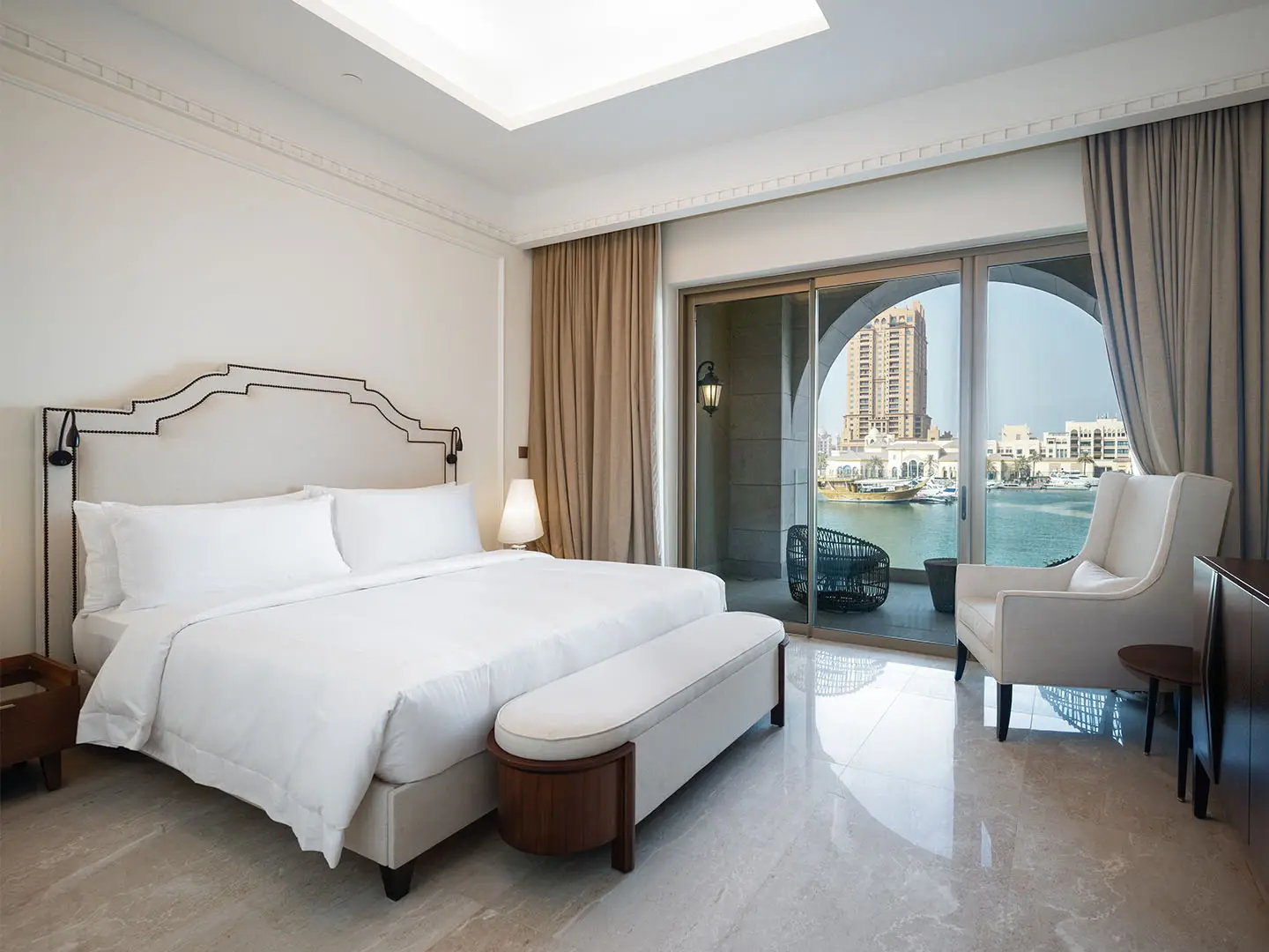 Bright room with arch and marina scenery