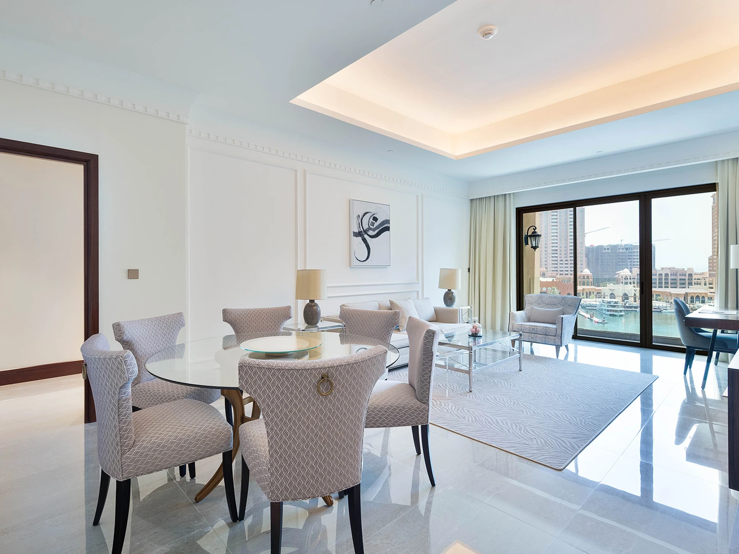 Dining chairs around glass table