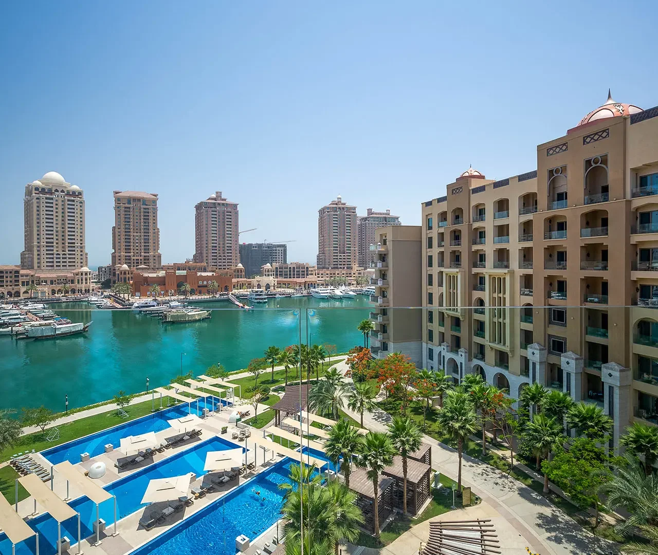 Marina with boats and pool in foreground