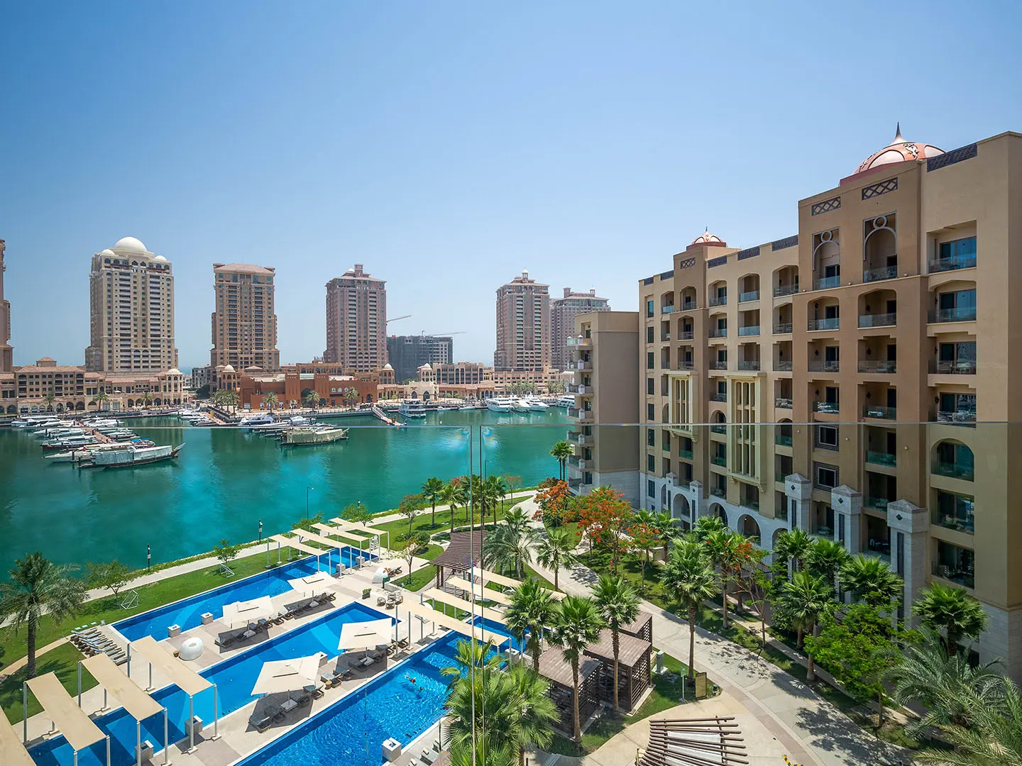 Marina with boats and pool in foreground