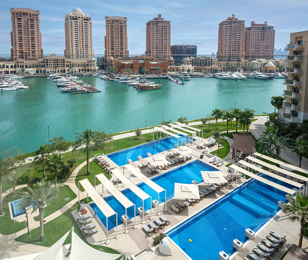Luxury pool and yachts in view
