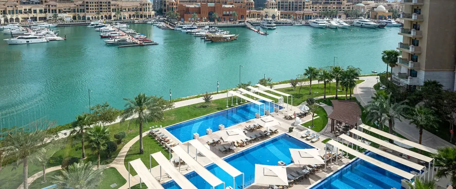 Luxury pool and yachts in view