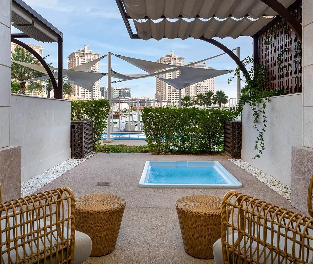 Covered patio with hot tub and seating