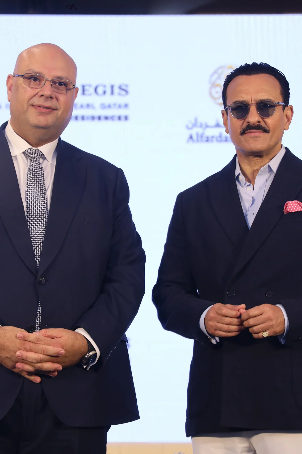 Formal portrait of two men in suits