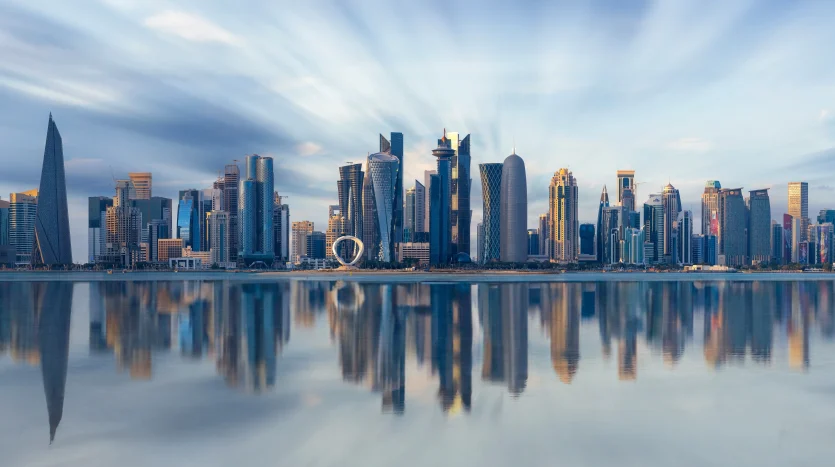 Modern Doha skyline reflected in the water