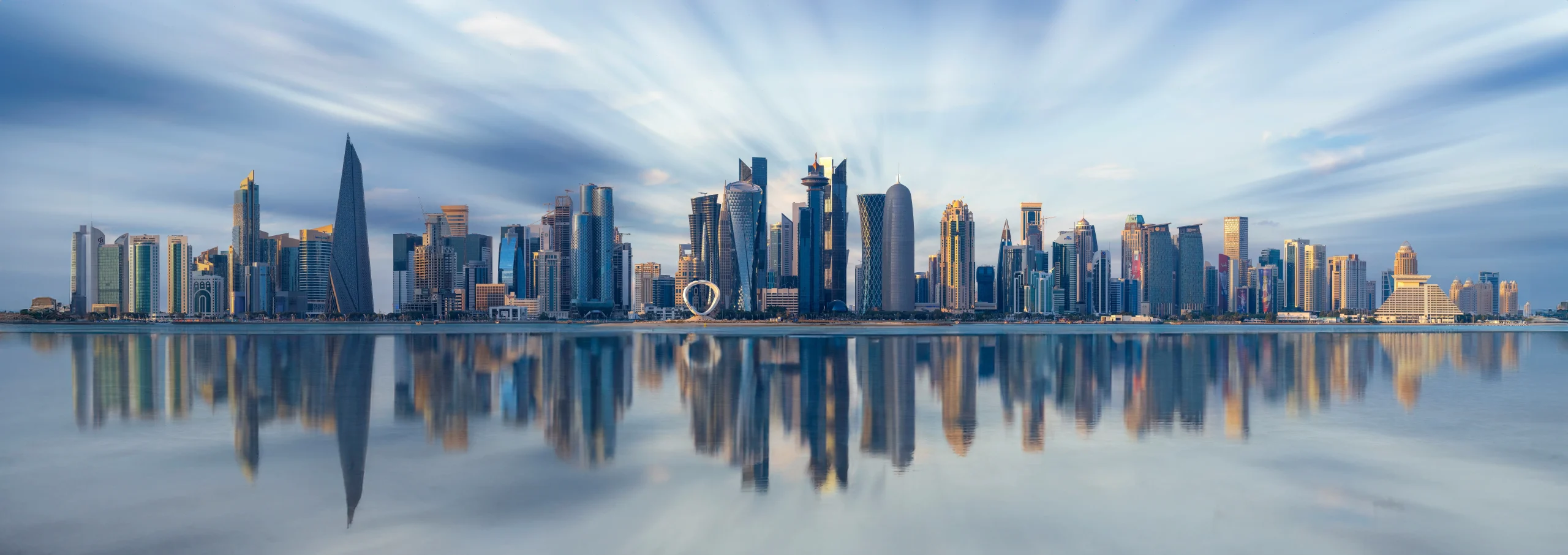 Modern Doha skyline reflected in the water