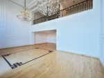 Empty room with chandeliers and wooden floor design