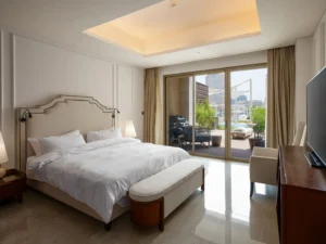 Stylish bedroom with armchair and lamps