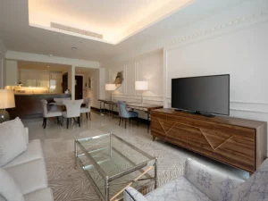 Elegant living space with large TV and lamps