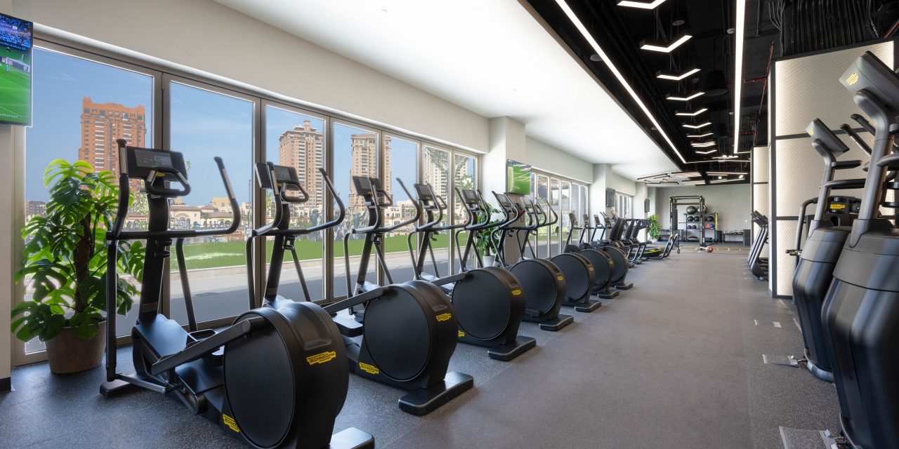 Spacious gym with modern elliptical machines