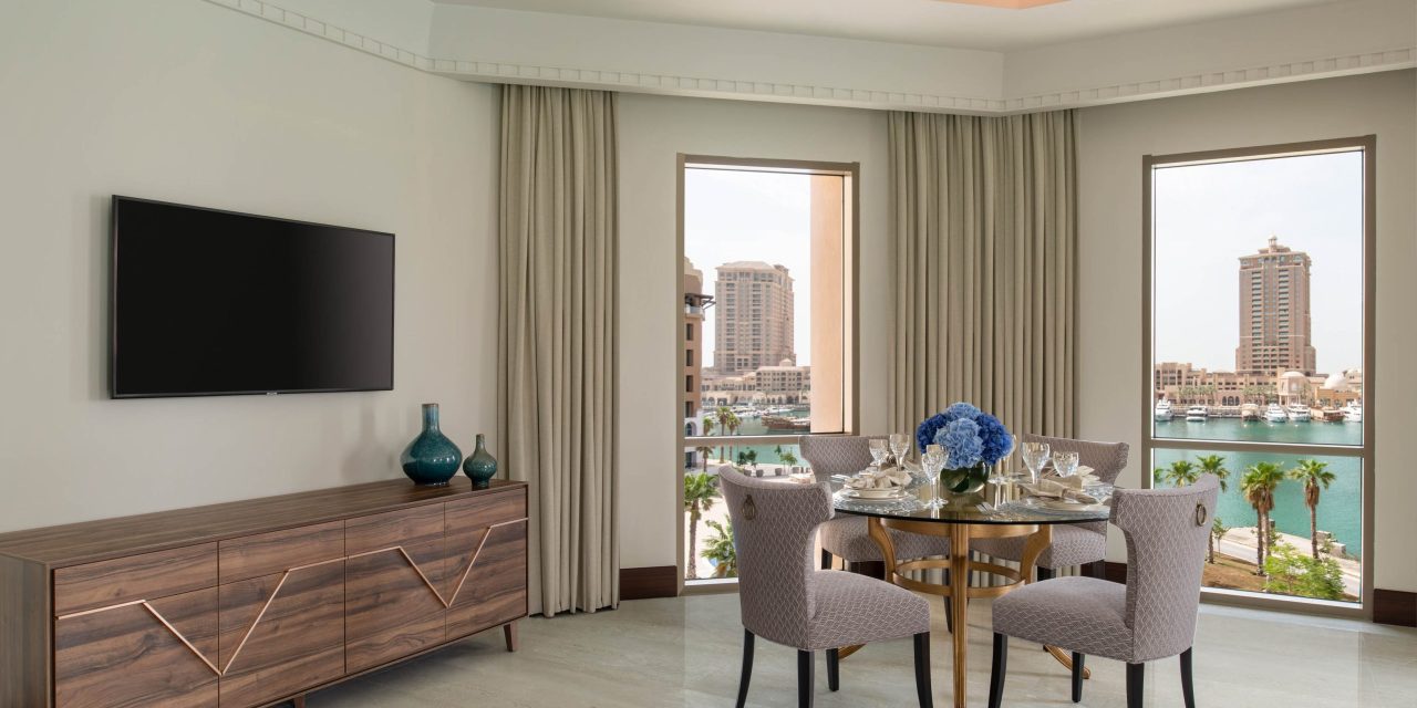 Stylish living and dining area with harbor view