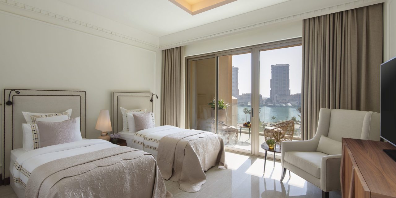 Contemporary twin bedroom with balcony and a sea view