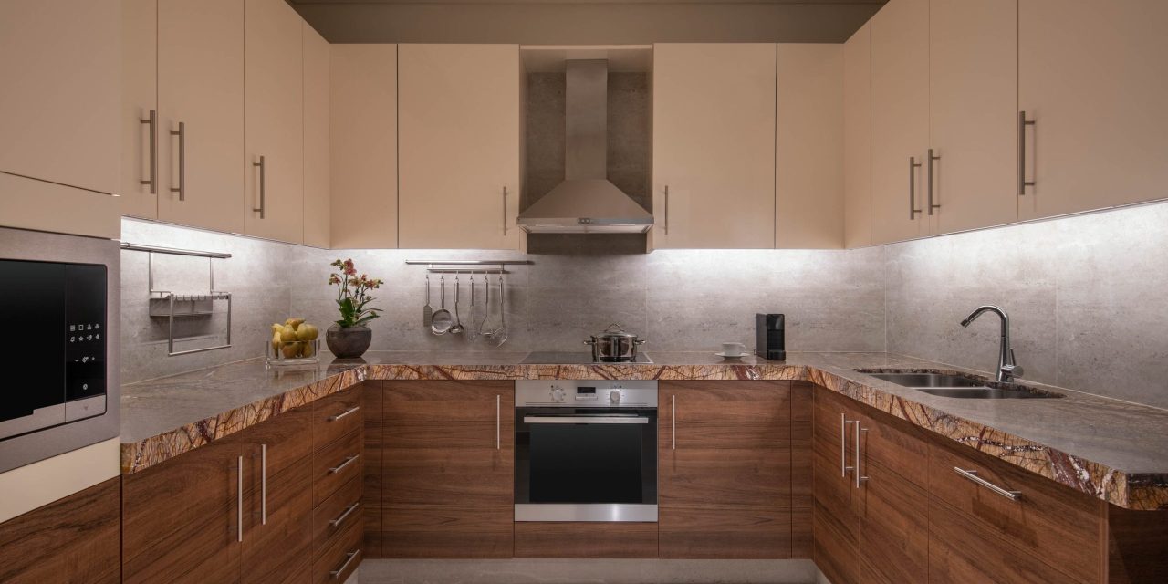 Modern kitchen with wood cabinets and stone countertop