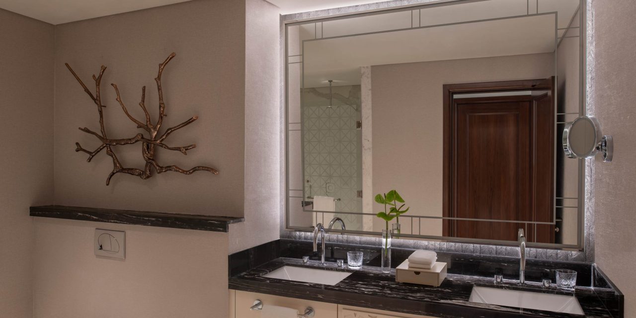 Stylish double sink bathroom with large mirror